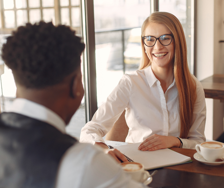 Woman giving feedback in man, in business attire